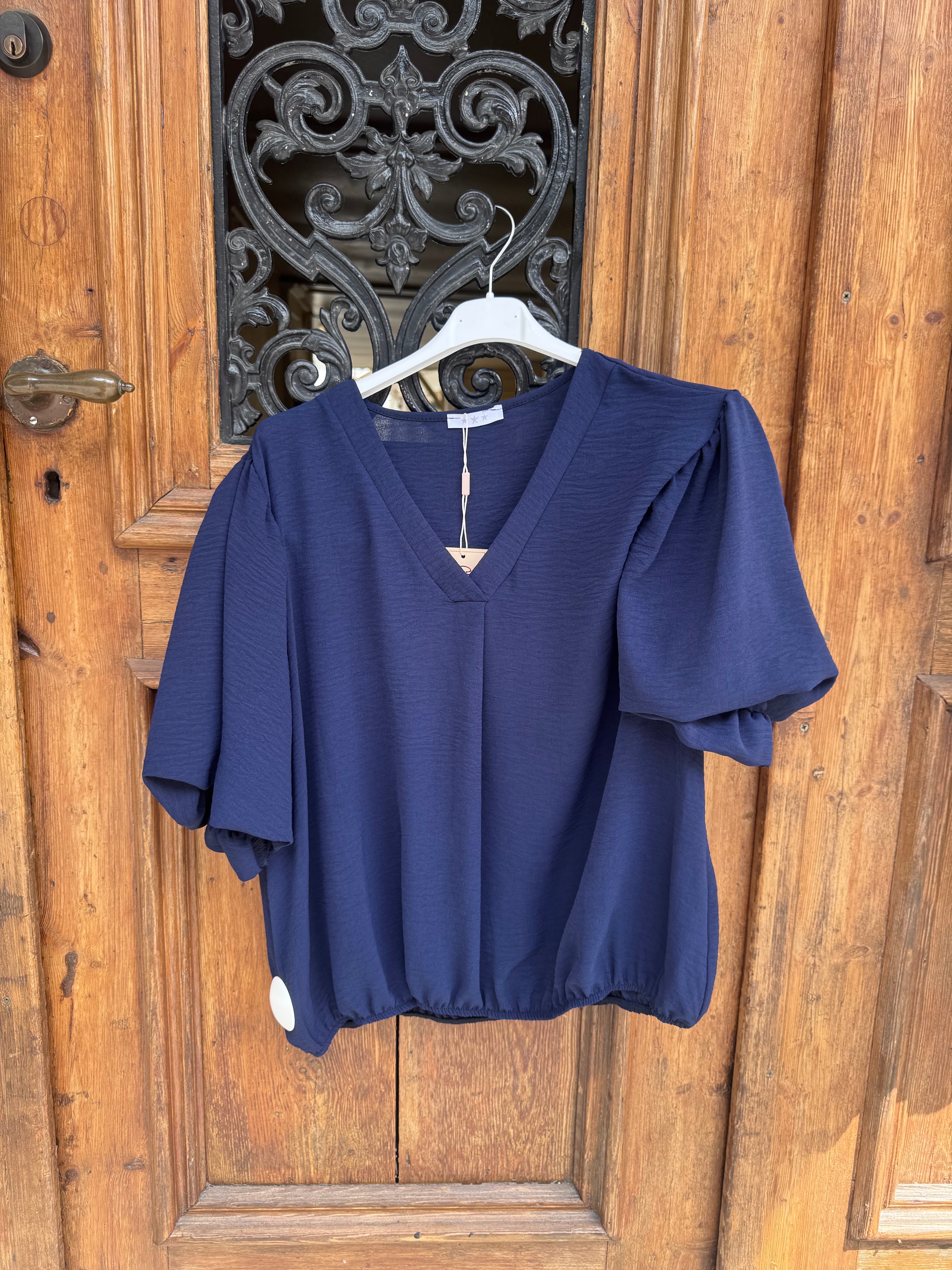 Caramelle V-ringad blus